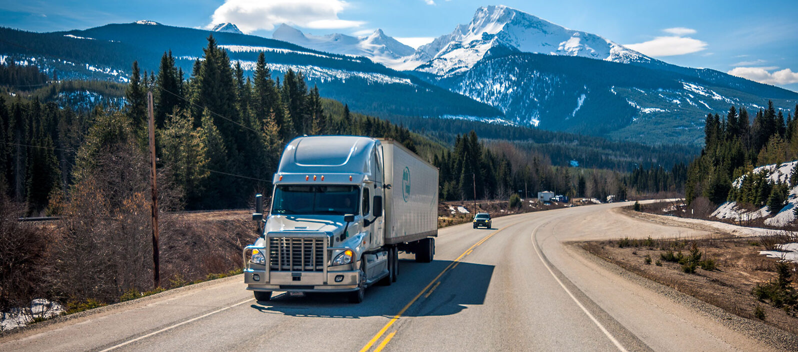 truck driving through valley