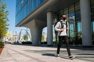 masked student on campus