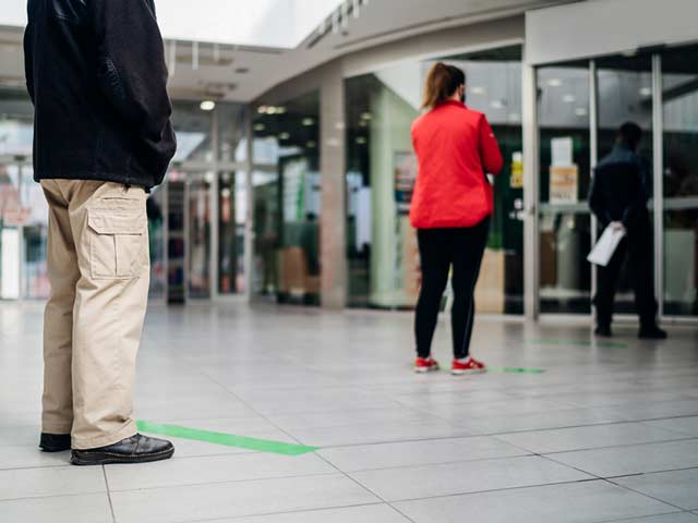 people in line social distance measures due to covid-19